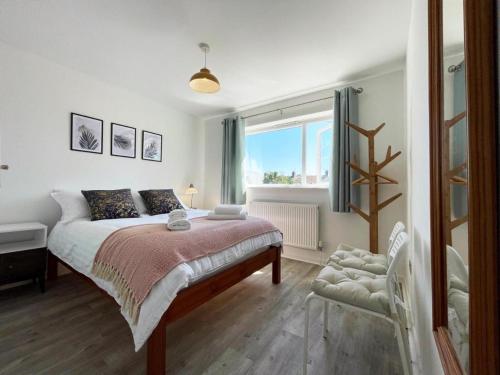 a bedroom with a large bed and a window at Grace's Place in Ely in Ely