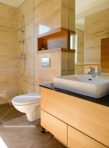 a bathroom with a sink and a toilet at Art Villa Mara in Vis