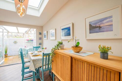 a kitchen and dining room with a table and chairs at Cosy Retreat in The City Centre in Galway