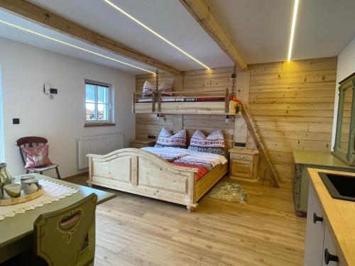 a bedroom with a bed in a room at Obinghof in Fieberbrunn