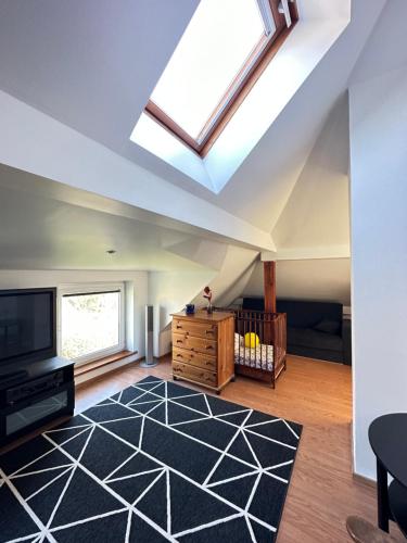 a skylight in a living room with a skylight at Penthouse located very close to the city center in Tallinn