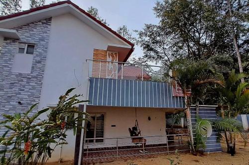 a white house with a fence in front of it at iSTAYS - Luxe Villa, Yercaud in Yercaud