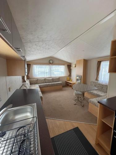 a room with a kitchen and a living room at The Willerby Vacation in Leysdown-on-Sea