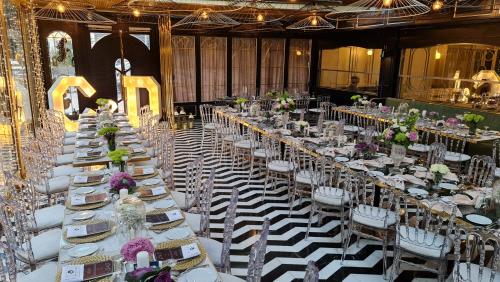 a banquet hall with white tables and chairs at Altinel Ankara Hotel & Convention Center in Ankara