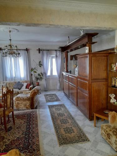 a living room with a couch and a table at Art House Syros in Ermoupoli