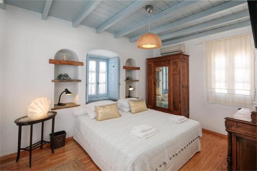 Posteľ alebo postele v izbe v ubytovaní Riviera Naxian Home