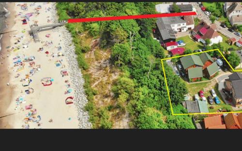 an overhead view of a beach with people on it at Pod Szklaną Wydmą - 2 min pieszo do plaży in Chłopy