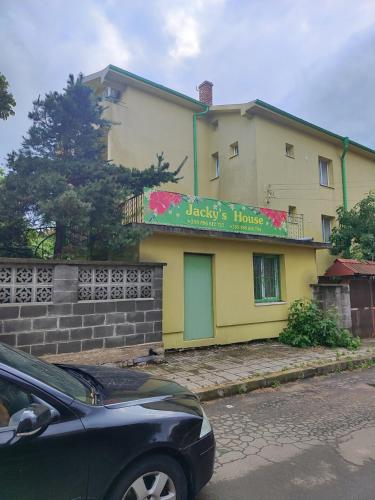 a car parked in front of a house at Jacky's House in Chernomorets