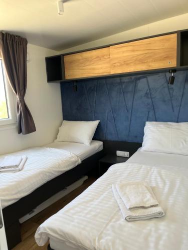 En eller flere senge i et værelse på Mala Oaza Terra Park Spiritos