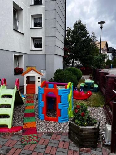 a backyard with a playground with a play set at Szyper in Jastarnia