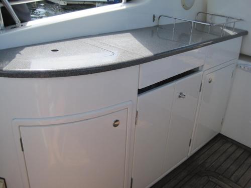 a kitchen with white cabinets and a sink at Dream Night Boats in Poreč