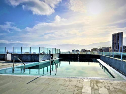 a swimming pool on the roof of a building at Hotel AF Valle Orotava in Puerto de la Cruz