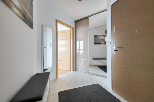 a hallway with a door leading to a bedroom at Dom & House - Apartamenty Sea Towers in Gdynia
