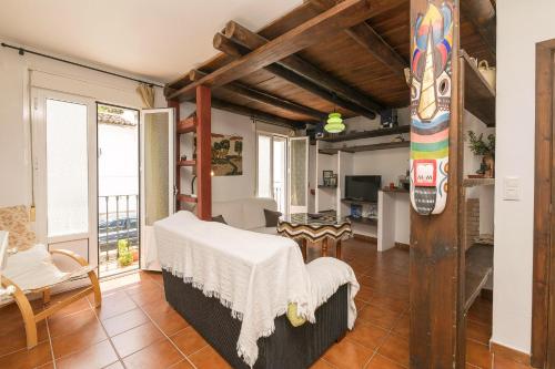 a bedroom with a bed in a room at Casa Paula in Benamahoma