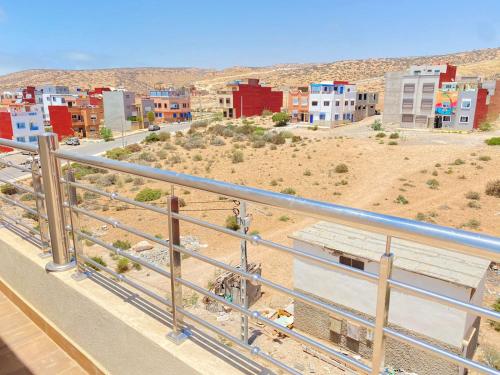 a view of a city from a balcony at Golden WAVE IMSOUANE in Imsouane