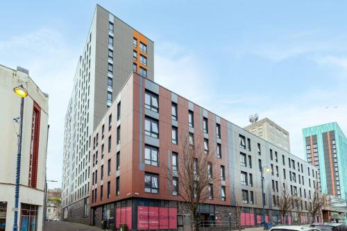 a building on a city street with tall buildings at For Students Only Fresh Oldway Centre Swansea in Swansea