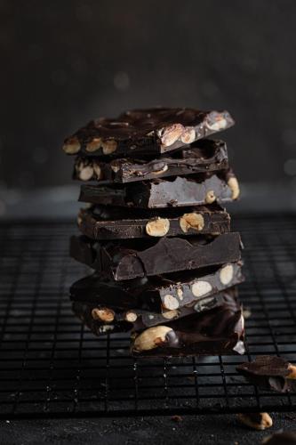 a stack of chocolate cookies on a cooling rack at Stayso The House Hotel in Istanbul