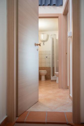 an open door to a bathroom with a toilet at La Casetta di Giorgio in Siculiana