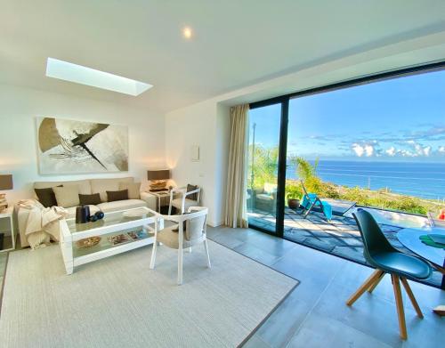 a living room with a view of the ocean at Casa Lava Luminosa y con Magníficas Vistas in La Orotava