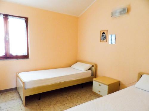Ένα ή περισσότερα κρεβάτια σε δωμάτιο στο Le Due Tortore Home Holiday