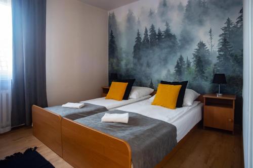 Een bed of bedden in een kamer bij Gościniec Wierchowy