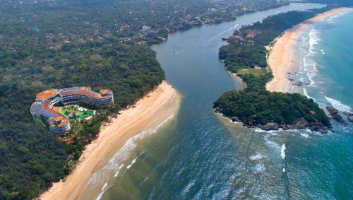 an aerial view of a resort on a beach at Occidental Eden Beruwala in Bentota