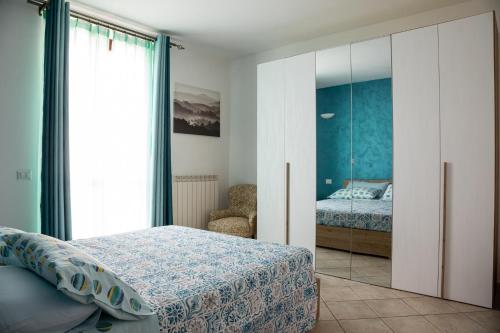 Appartamento Giulia tesisinde bir odada yatak veya yataklar