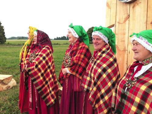 a group of older women dressed in plaid at Zaku Krogs in Jūrkalne