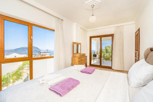 A bed or beds in a room at Villa Asya 2