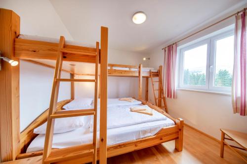 a bedroom with bunk beds in a house at Königsblick in Königsleiten