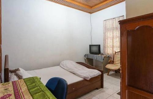A bed or beds in a room at Mountain View Homestay