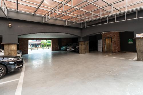 a parking garage with a car parked in it at Jecheon Hound Hotel in Jecheon