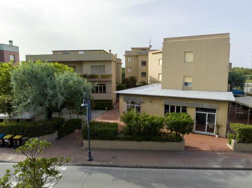 a view of a building with trees and buildings at Hotel Quisisana in Vada