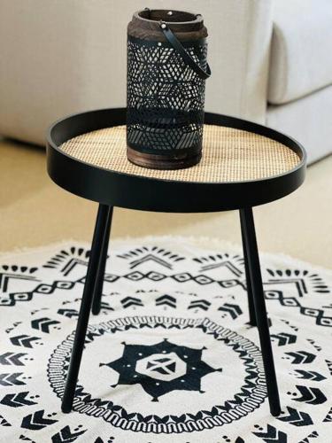 a black table with a cup on top of it at Appartement confortable in Laon