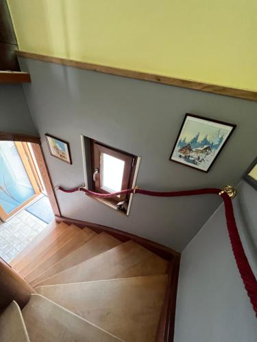 a view of a stairway with a rope connecting it to a room at Le Cerisier - Route des vins - Parking et terrasse avec vue sur montagnes et vignoble in Sigolsheim