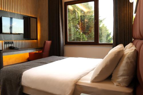 Postel nebo postele na pokoji v ubytování Hotel Lazlakar