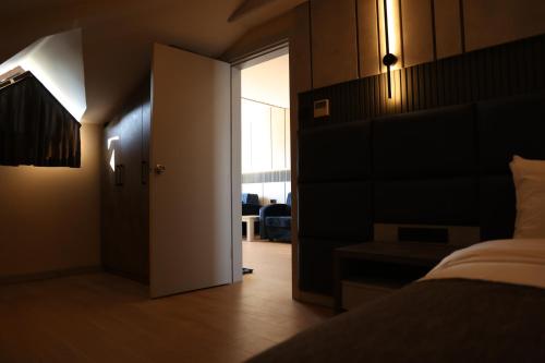 Postel nebo postele na pokoji v ubytování Hotel Lazlakar