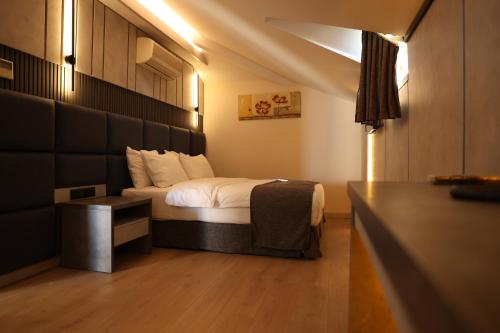 Postel nebo postele na pokoji v ubytování Hotel Lazlakar