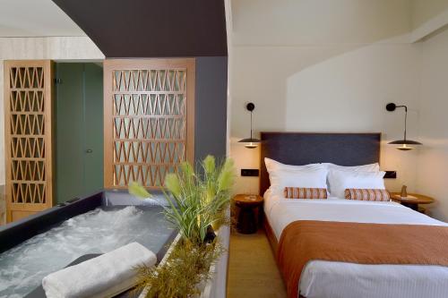 Aktaion Beach Boutique Hotel & Spaにあるベッド