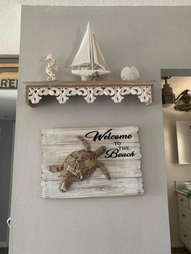 a sign on a wall with a turtle on it at Ormond Beach, fun & loving sun! in Ormond Beach