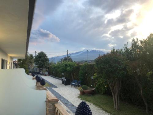 a balcony of a house with a view of a mountain at Paradise Sicily Rooms in Calatabiano