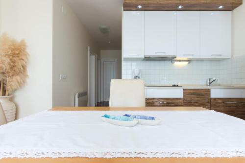 a kitchen with a table with two dishes on it at Villa Mare Crikvenica in Crikvenica