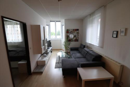 a living room with a couch and a table at Ferienwohnung GGM in Judenburg