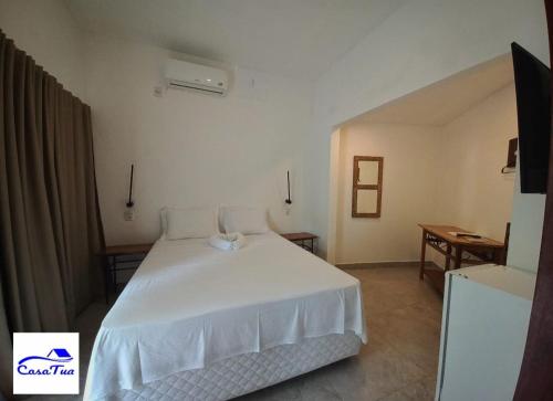 Ένα ή περισσότερα κρεβάτια σε δωμάτιο στο Casa Tua Pipa