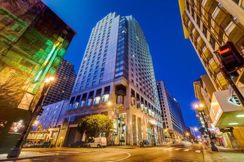a tall building on a city street at night at Hotel Nikko San Francisco in San Francisco