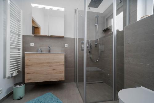 a bathroom with a shower and a sink and a toilet at Haus Nordketten Blick in Schönberg im Stubaital