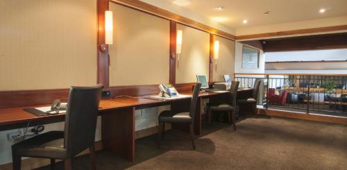 a conference room with a long table and chairs at Copthorne Hotel Rotorua in Rotorua