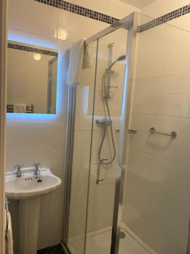 a bathroom with a shower and a sink at The Lodge Donegal Town in Donegal