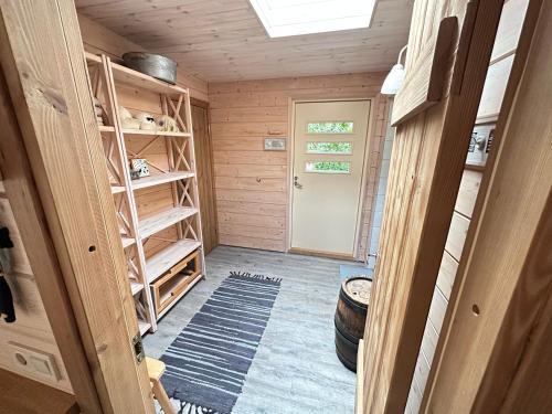 a small room with a door and a room with a door at Natura Sauna in Laulasmaa