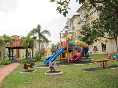 a playground with a slide in a park at U8 TAMAN BUKIT JELUTONG, SECTION U8, 40150 SHAH ALAM Fully Air-Con Suite in Shah Alam